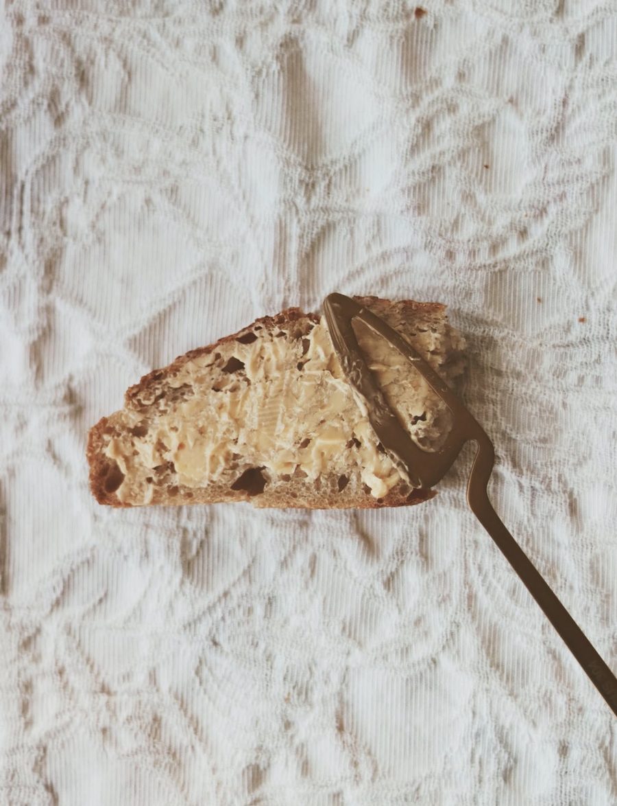 A thick slice of sourdough generously spread with butter