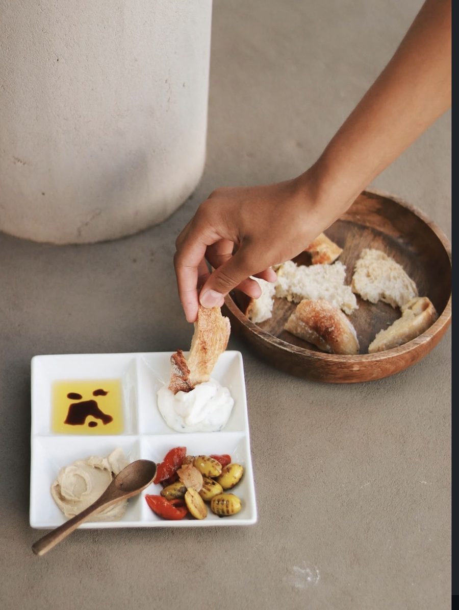 Toasted sourdough soldiers with hummus, tzatziki, olive oil and olives
