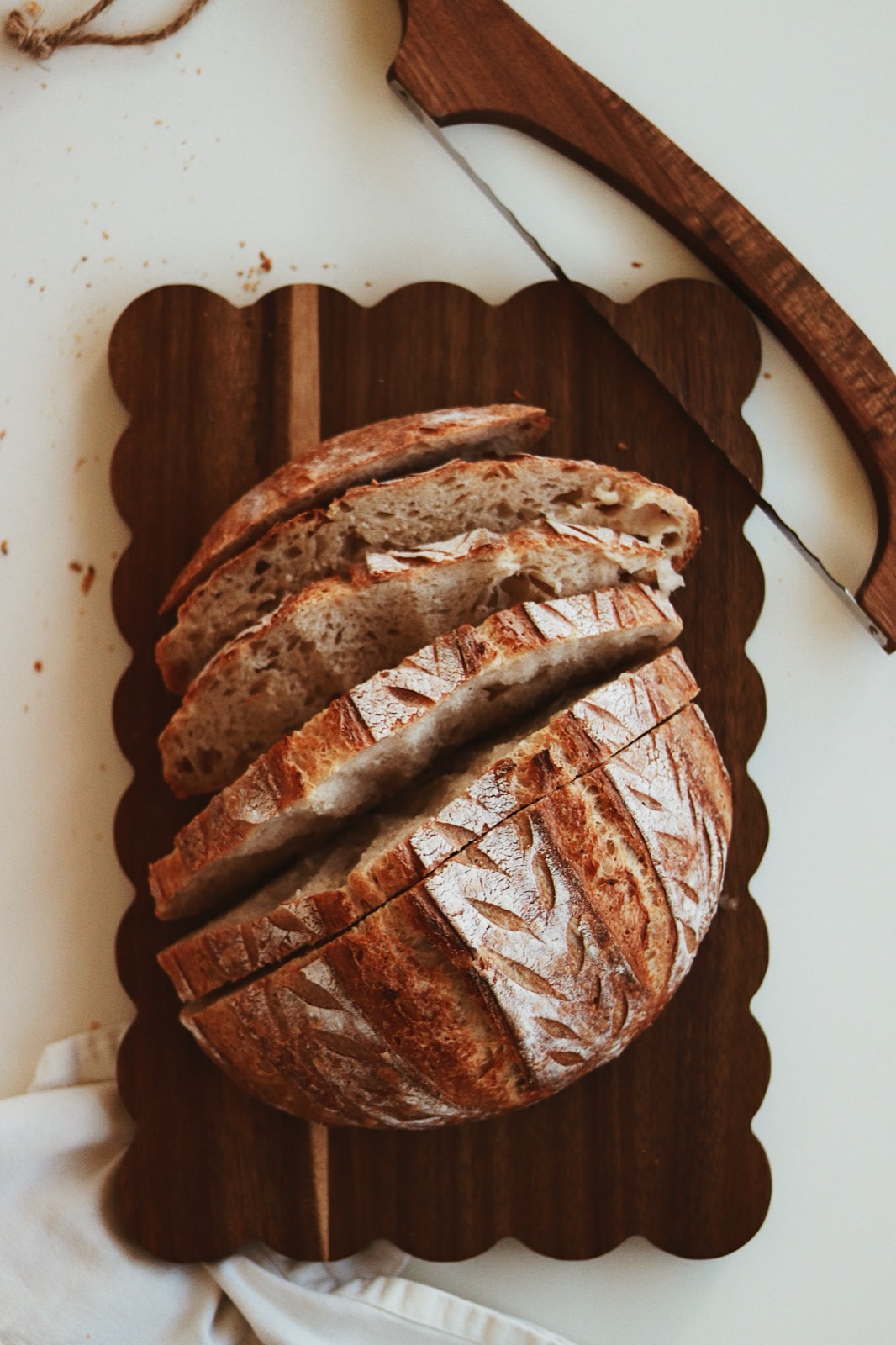 Close-up of the original sourdough crust and flour-dusted score